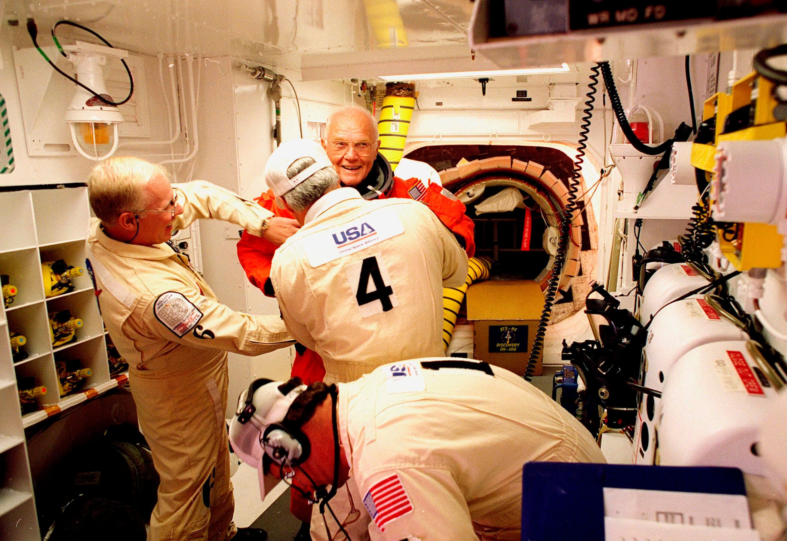 John H. Glenn Jr. has flight suit checked before climbing into space shuttle Discovery for second flight into space at Kennedy Space Center