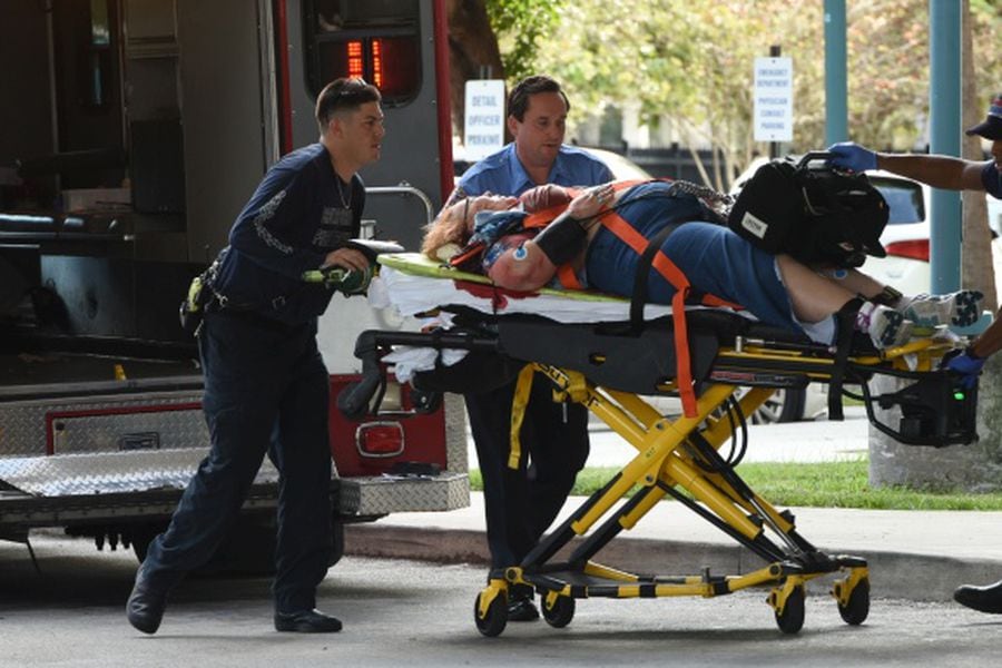 An injured woman is taken into Broward Health Trauma Center in Fort L