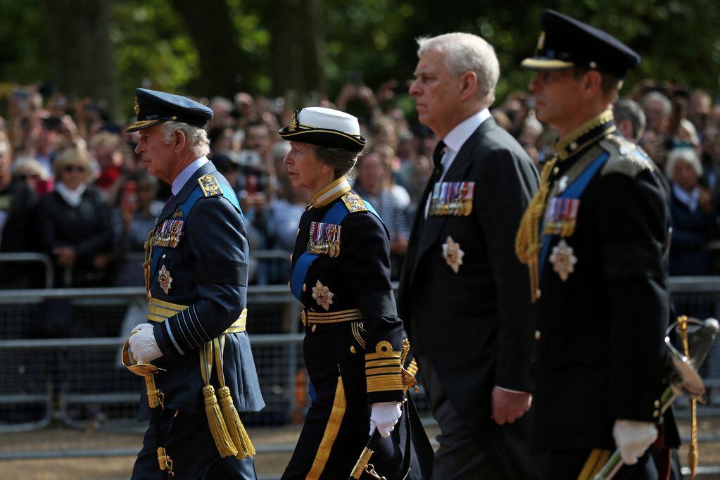 Britain's King Charles III, Britain's Princess Anne, Princess Royal, Britain's Prince Andrew, Duke of York, Britain's Prince Edward, Earl of Wessex walk behind the coffin of Queen Elizabeth II, adorned with a Royal Standard and the Imperial State Crown and pulled by a Gun Carriage of The King's Troop Royal Horse Artillery, during a procession from Buckingham Palace to the Palace of Westminster, in London on September 14, 2022. - Queen Elizabeth II will lie in state in Westminster Hall inside the Palace of Westminster, from Wednesday until a few hours before her funeral on Monday, with huge queues expected to file past her coffin to pay their respects.     ISABEL INFANTES/Pool via REUTERS