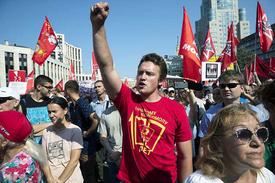 A man gestures during the Communist Party rally protesting retirement
