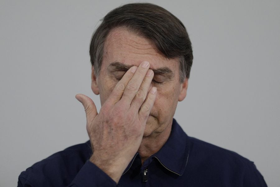 Presidential candidate Jair Bolsonaro gestures during a news conference at a campaign office in Rio de Janeiro