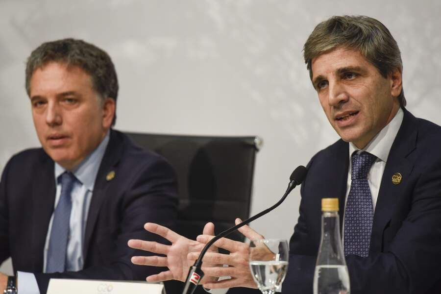 Argentine Central Bank President Luis Caputo speaks as Argentine Trea