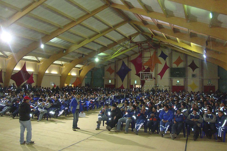 Striking workers gather in the gym at the Escondida mine site in Antofagasta