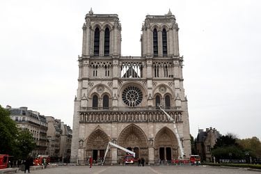 Firefighters work at Notre Dame Cathedral after a fire devastated large parts of the gothic gem in Paris