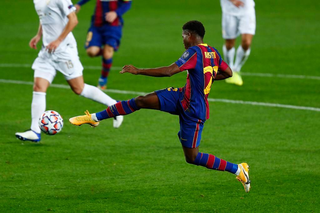 Barcelona's Ansu Fati scores his side's second goal during the Champions League group G soccer match between FC Barcelona and Ferencvaros at the Camp Nou stadium in Barcelona, Spain, Tuesday, Oct. 20, 2020. (AP Photo/Joan Monfort)