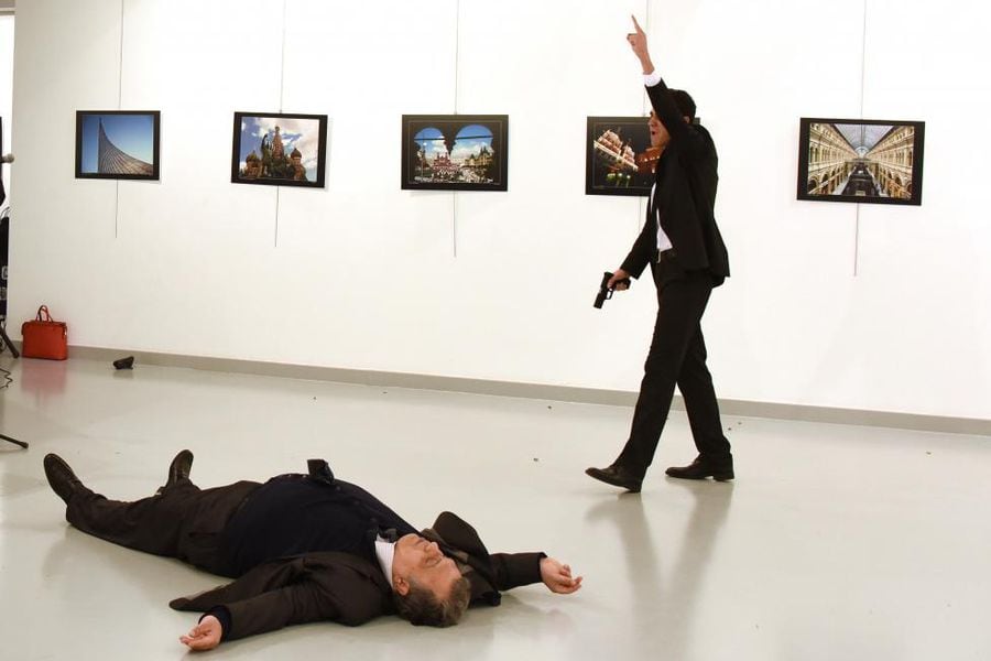 Russian Ambassador to Turkey Karlov lies on the ground after he was shot by unidentified man at an art gallery in Ankara