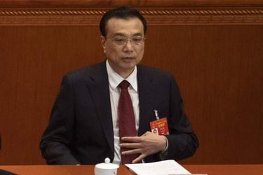 Chinese Premier Li Keqiang reacts after delivering his work report at