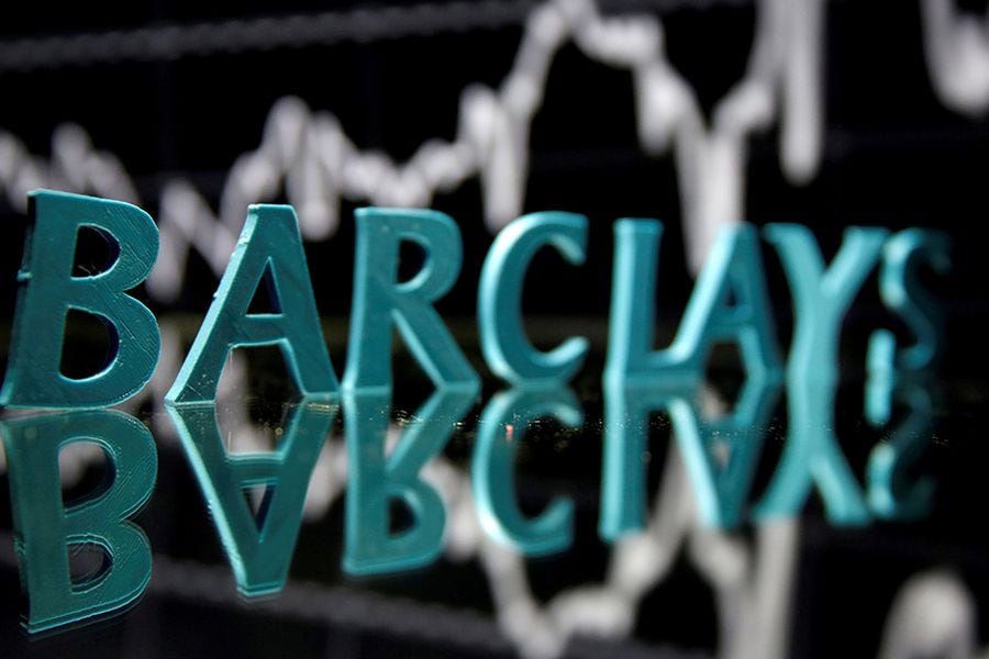 FILE PHOTO: The Barclays logo is seen in front of displayed stock graph in this illustration