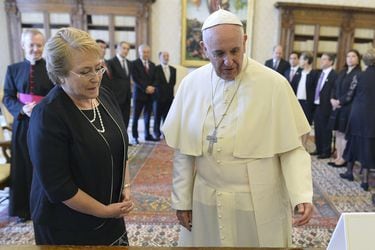 Pope Francis exchanges gifts with Chile's President Michelle Bachelet during a private audience at the Vatican