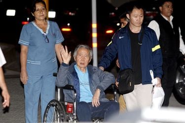 FILE PHOTO: Former Peruvian President Alberto Fujimori accompanied by his son Kenji Fujimori leaves hospital Centenario in Lima