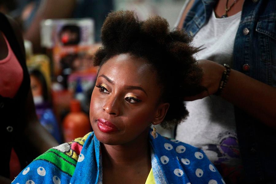 Nigerian novelist Chimamanda Ngozi Adichie sits in a salon for her hair-do in Victoria Island district in Lagos