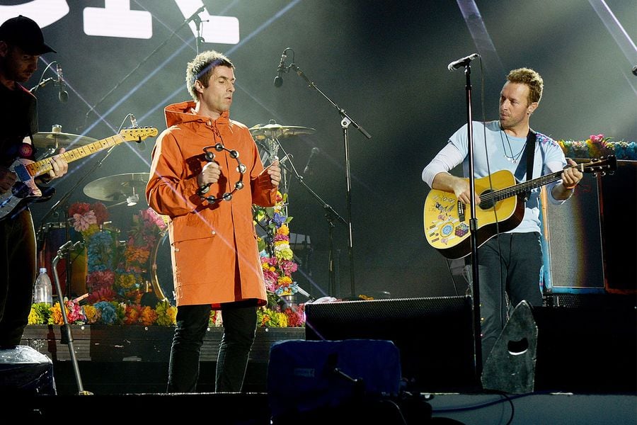 Liam-Gallagher-and-Chris-Martin-of-Coldplay-perform-on-stage-during-the-One-Love-Manchester-Benefit-Concert-2017-billboard-1548