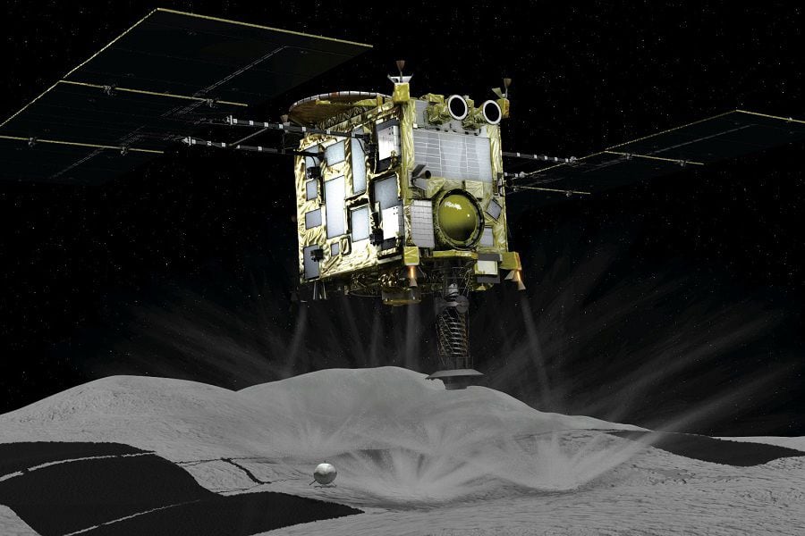 A computer graphic handout image shows Japan Aerospace Exploration Agency's Hayabusa 2 probe touches down on an asteroid in outer space