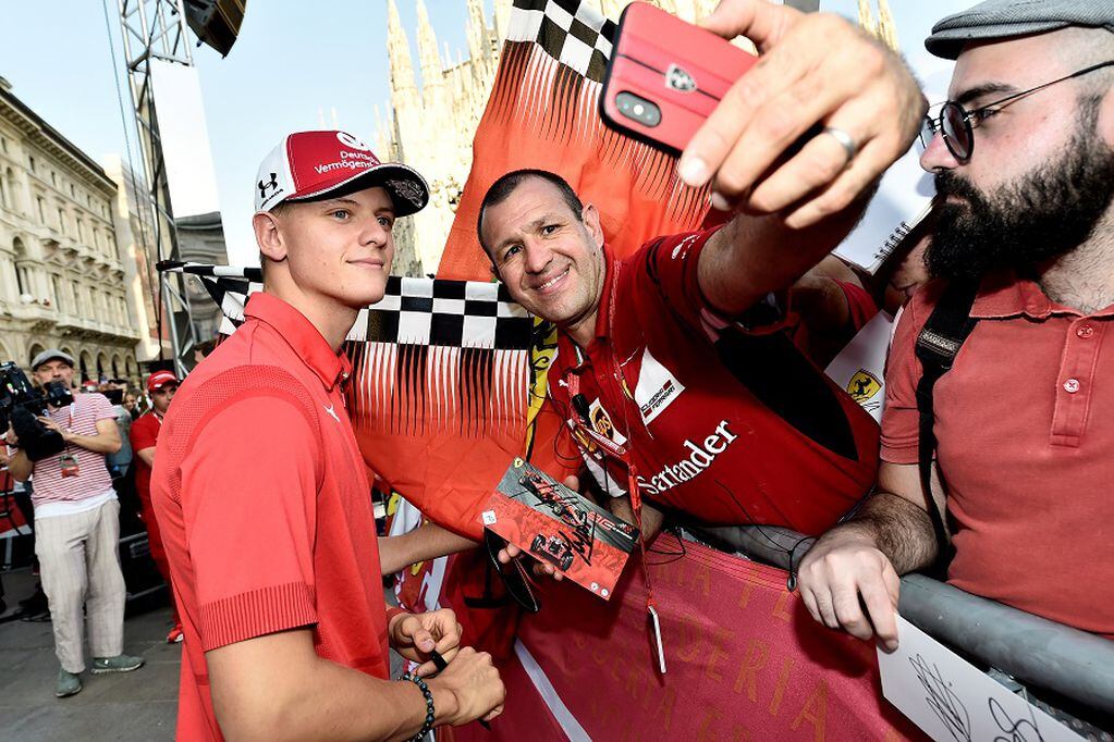 FILE PHOTO: Racing driver Mick Schumacher poses for a selfie photo as he attends an event to celebrate 90 years of Italian premium sports car maker Ferrari racing team at Milan's Duomo square, in Milan, Italy September 4, 2019. REUTERS/Flavio lo Scalzo/File Photo