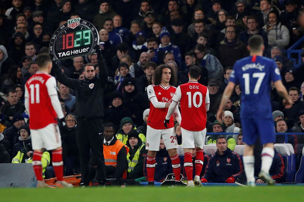 FILE PHOTO: Soccer Football - Premier League - Chelsea v Arsenal - Stamford Bridge, London, Britain - January 21, 2020  Arsenal's Matteo Guendouzi comes on as a substitute to replace Mesut Ozil   Action Images via Reuters/Paul Childs  EDITORIAL USE ONLY. No use with unauthorized audio, video, data, fixture lists, club/league logos or "live" services. Online in-match use limited to 75 images, no video emulation. No use in betting, games or single club/league/player publications.  Please contact your account representative for further details./File Photo