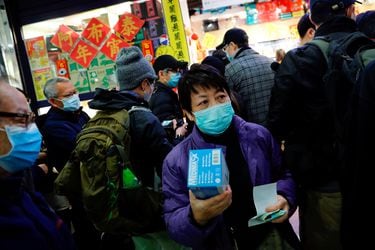 Customers queue to buy facial masks to prevent a new coronavirus outbreak in Hong Kong
