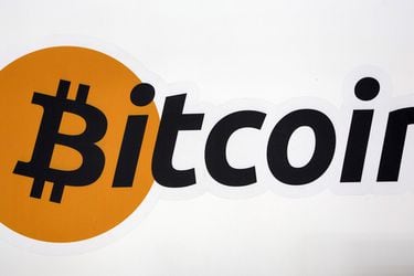 FILE PHOTO: A Bitcoin logo is displayed at the Bitcoin Center New York City in New York's financial district