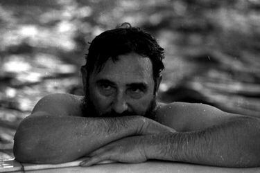 File photo of Fidel Castro relaxing a swimming pool in Romania
