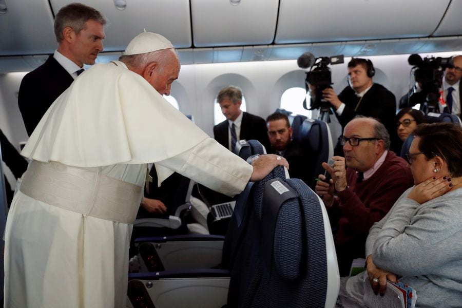 Reuters correspondent Pullella asks Pope Francis a question on the plane flying from Tokyo to Rome