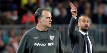 FILE PHOTO: Barcelona's coach Pep Guardiola and Athletic Bilbao's coach Marcelo Bielsa react during their Spanish First division soccer league match at Camp Nou stadium in Barcelona