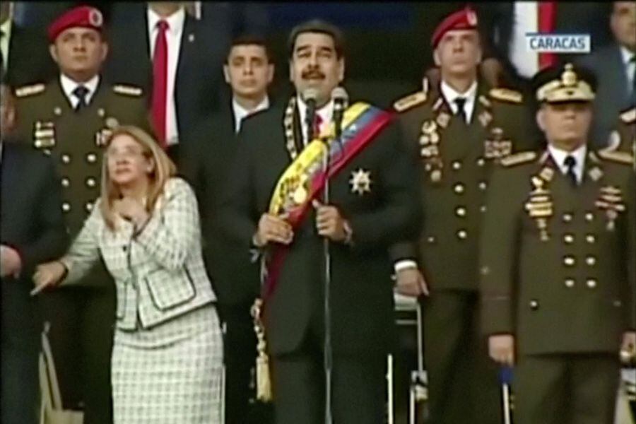 Venezuelan President Nicolas Maduro reacts during an event which was interrupted, in this still frame taken from video