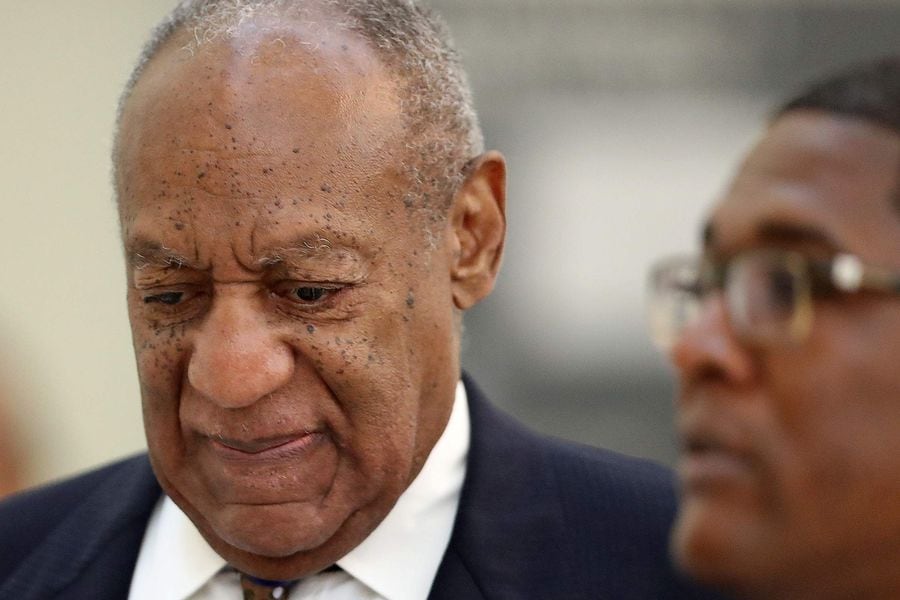 Actor and comedian Bill Cosby returns to the courtroom after a break with his spokesman Andrew Wyatt at the Montgomery County Courthouse