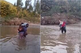 La historia del padre no vidente que cruza un río con sus hijos para que vayan al colegio
