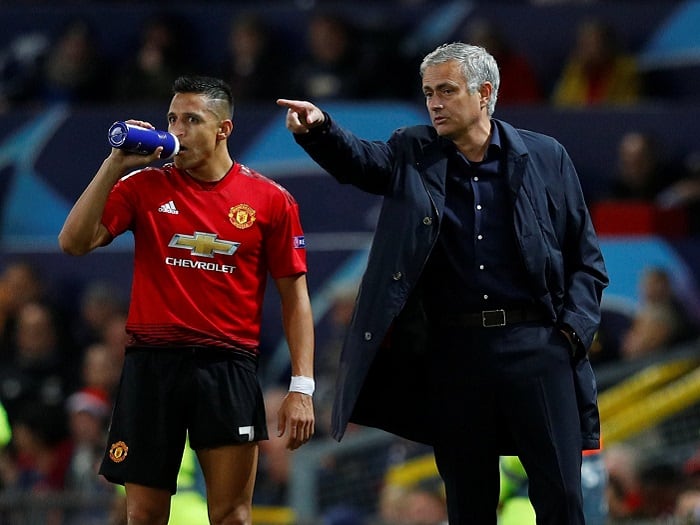 Alexis Sánchez y José Mourinho.