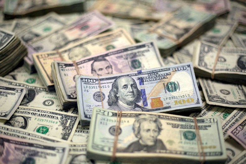 FILE PHOTO: U.S. dollar banknotes are seen in this photo illustration