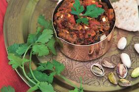 Berenjena ahumada con tomates y comino