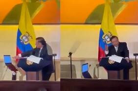 Presidente de Colombia utiliza a un funcionario como “trípode humano” para sujetarle el notebook