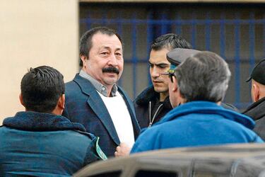 Chilean citizen Sergio Galvarino Apablaza is led into court by police officers