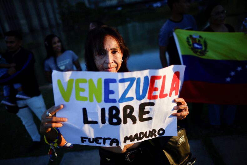 Venezuelan citizens take part in a protest against the electoral results that awarded Venezuela's President Nicolas Maduro, in Brasilia