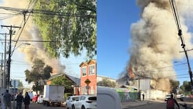 Bomberos combate contra incendio de panadería de Cerro Navia