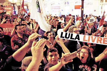 Supporters of the former Brazilian President Luiz Inacio Lula da Silva attend a rally in Curitiba