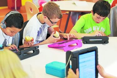 Students practise on their iPads at the Steve Jobs school in Sneek