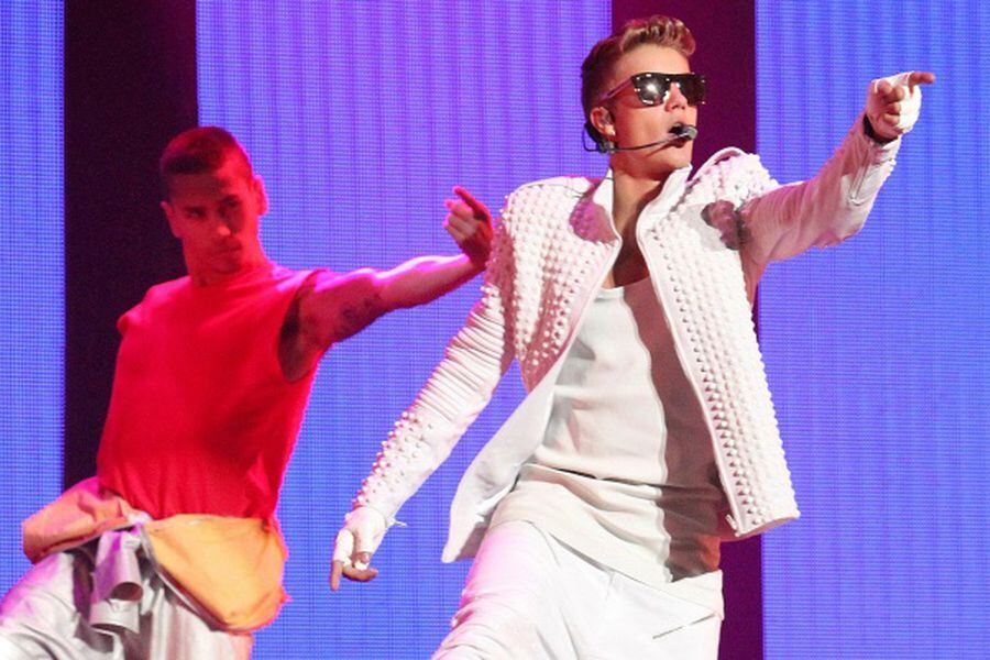 FILE PHOTO - Canadian pop singer Bieber performs during his world tour concert in Beijing