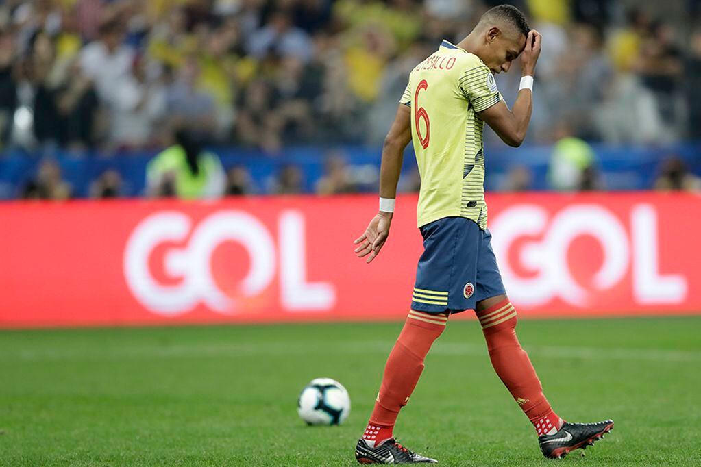 Colombia's William Tesillo looks down after missing to score during a penalty kick shoot-out against Chile in a Copa America quarterfinal soccer match at the Arena Corinthians in Sao Paulo, Brazil, Friday, June 28, 2019. Chile beat Colombia 5-4 on pena...