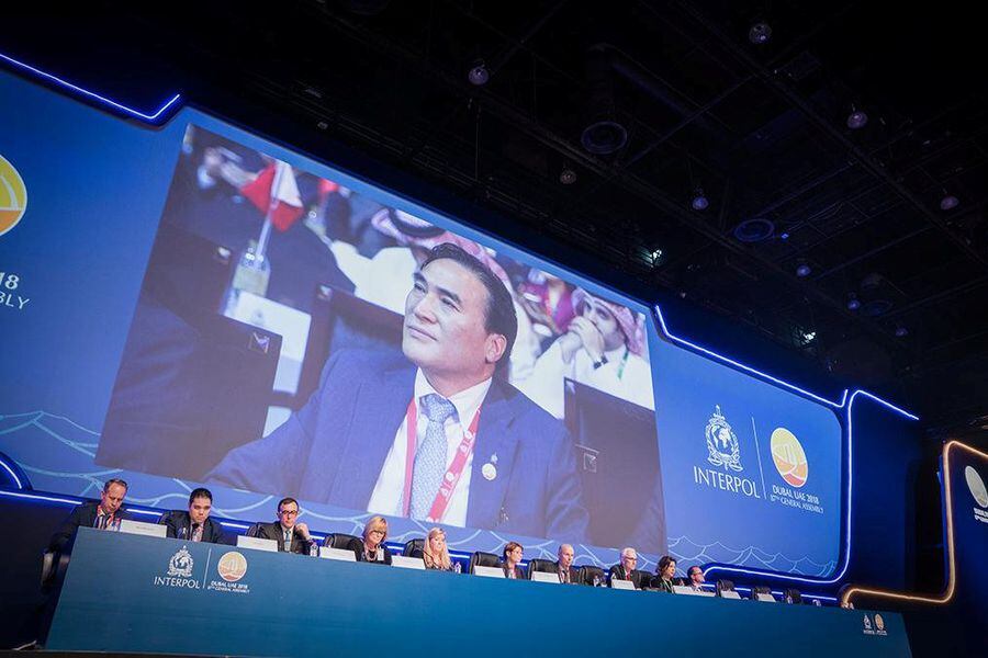 Screen shows the picture of Kim Jong-yang of South Korea, the new president of International police body Interpol during the 87th General Assembly in Dubai