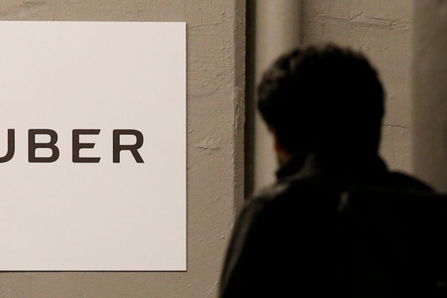 FILE PHOTO -  A man arrives at the Uber offices in Queens, New York
